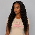 Front view of a 13x4 Deep Wave Lace Human Hair Wig on a dark chocolate skin model wearing a beige WigMatch EU t-shirt. Natural deep wave texture with a middle part, realistic hairline, HD lace finish, and soft gray studio background.