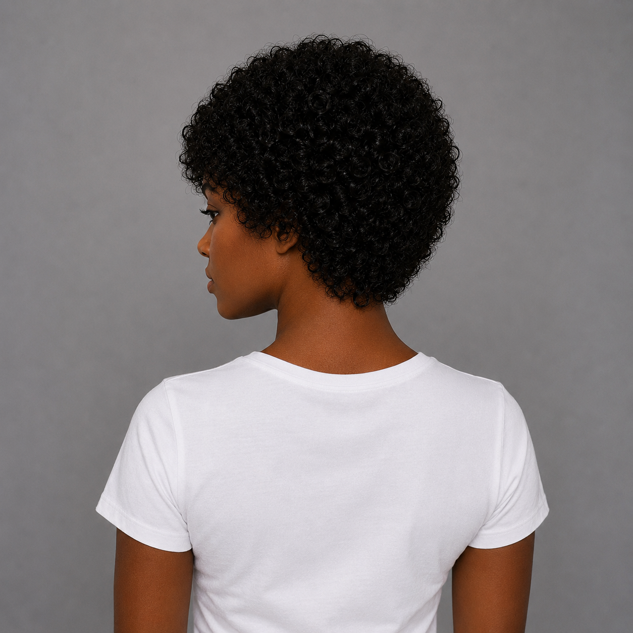 Back view of Premium Natural Black Afro Curly Human Hair Wig showcasing the natural afro curl pattern, realistic density, and full rounded shape.