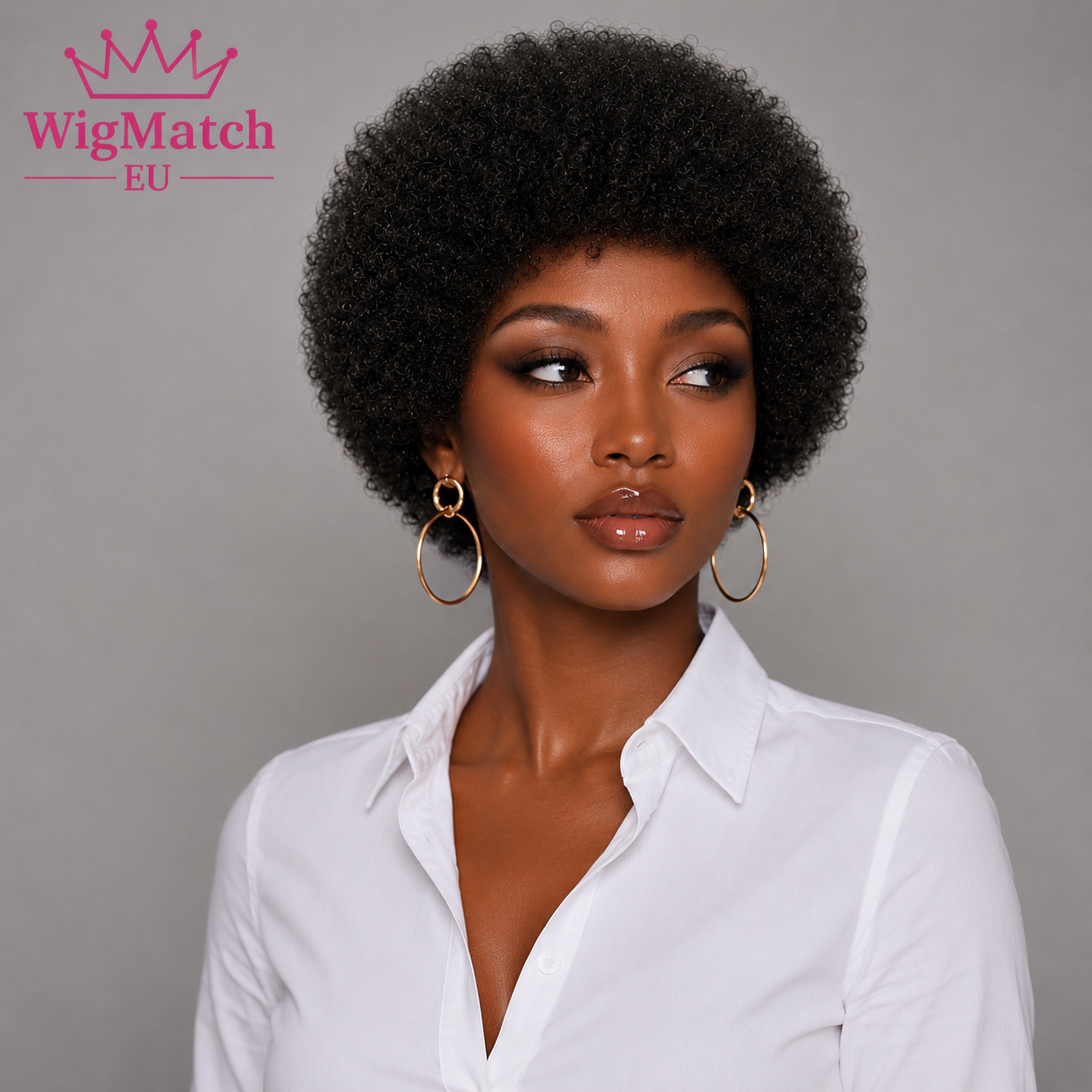 Woman wearing Short Afro Kinky Curly Human Hair Wig in Natural Black, looking 45 degrees to the left, showcasing the soft kinky curly texture with a natural rounded afro shape, wearing a white shirt against a light gray background | WigMatch EU