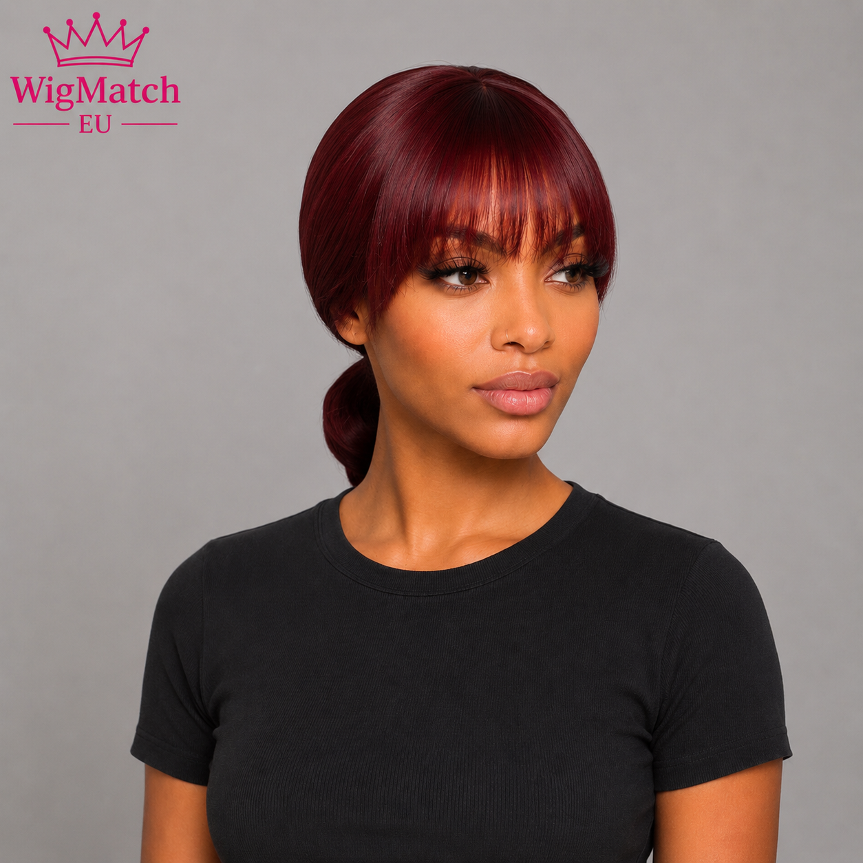 Woman wearing the Short Burgundy Red Straight Human Hair Bob Wig with Full Bangs, showcasing the smooth straight texture, rich burgundy red shade, full bangs, natural movement, and a clean left-side profile.